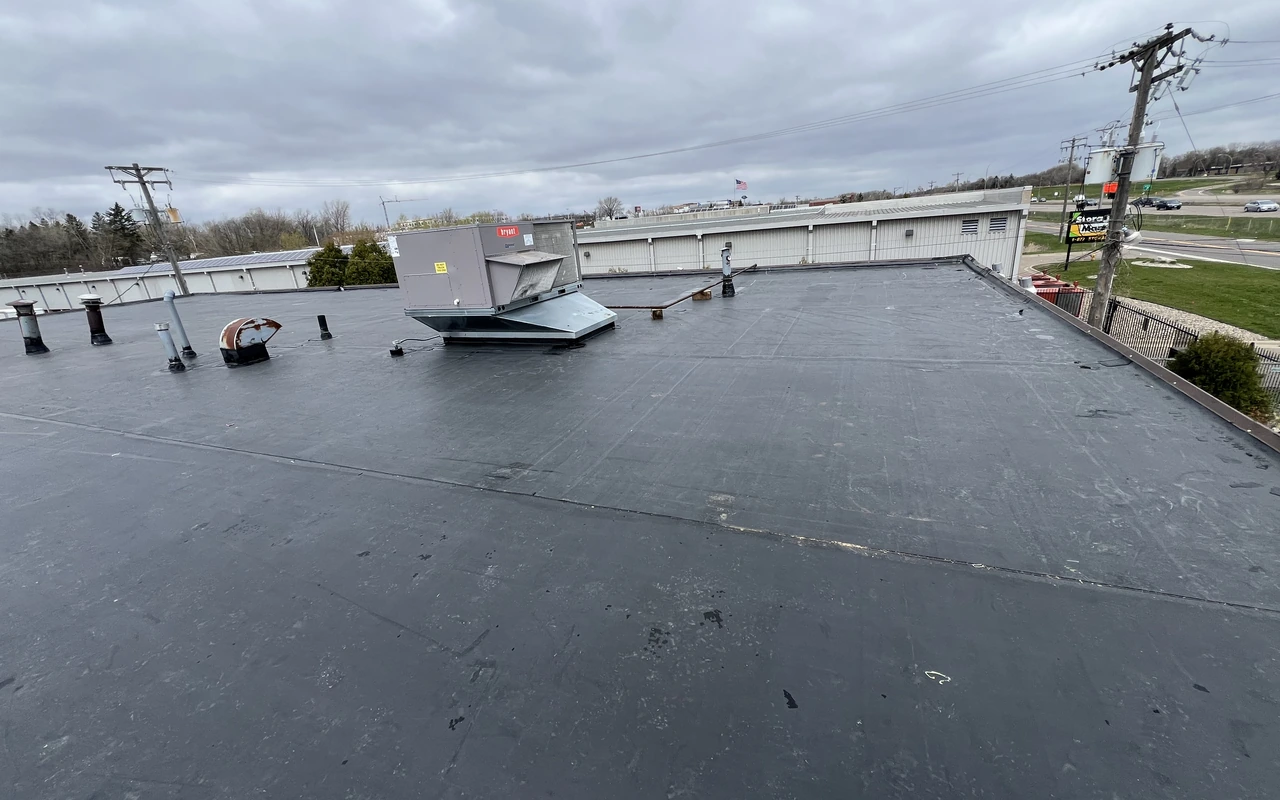 EPDM commercial flat roof on retail property in Maple Grove, MN by Altus Roofing