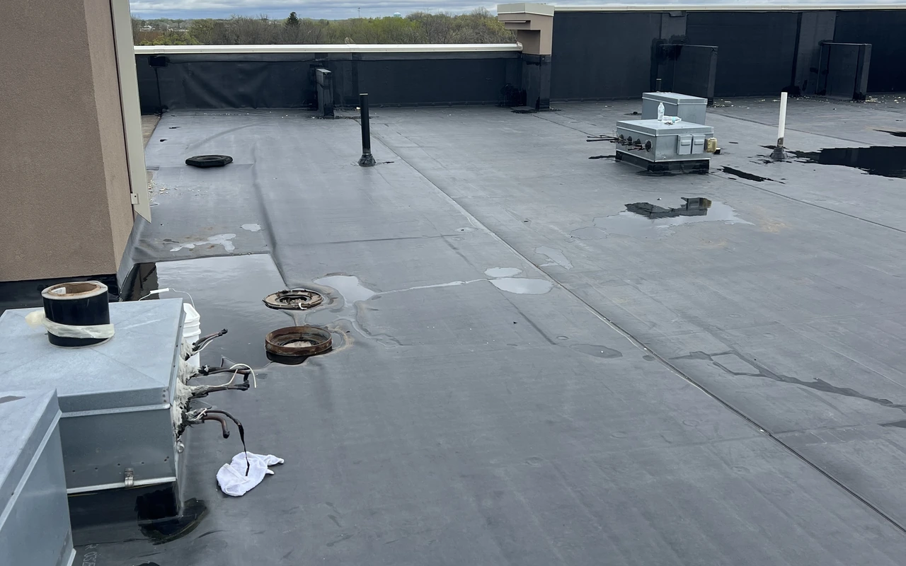 Commercial flat roof with HVAC and drain detail in St. Paul, MN by Altus Roofing