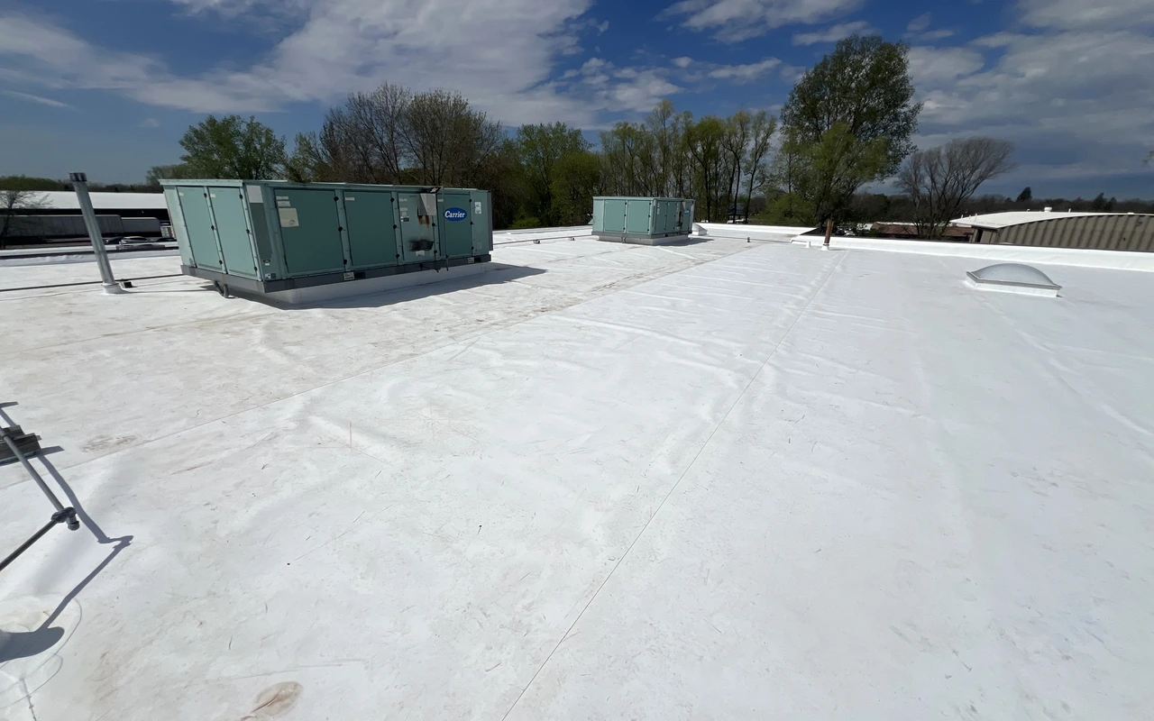 Commercial TPO flat roof with rooftop HVAC units in Plymouth, MN by Altus Roofing