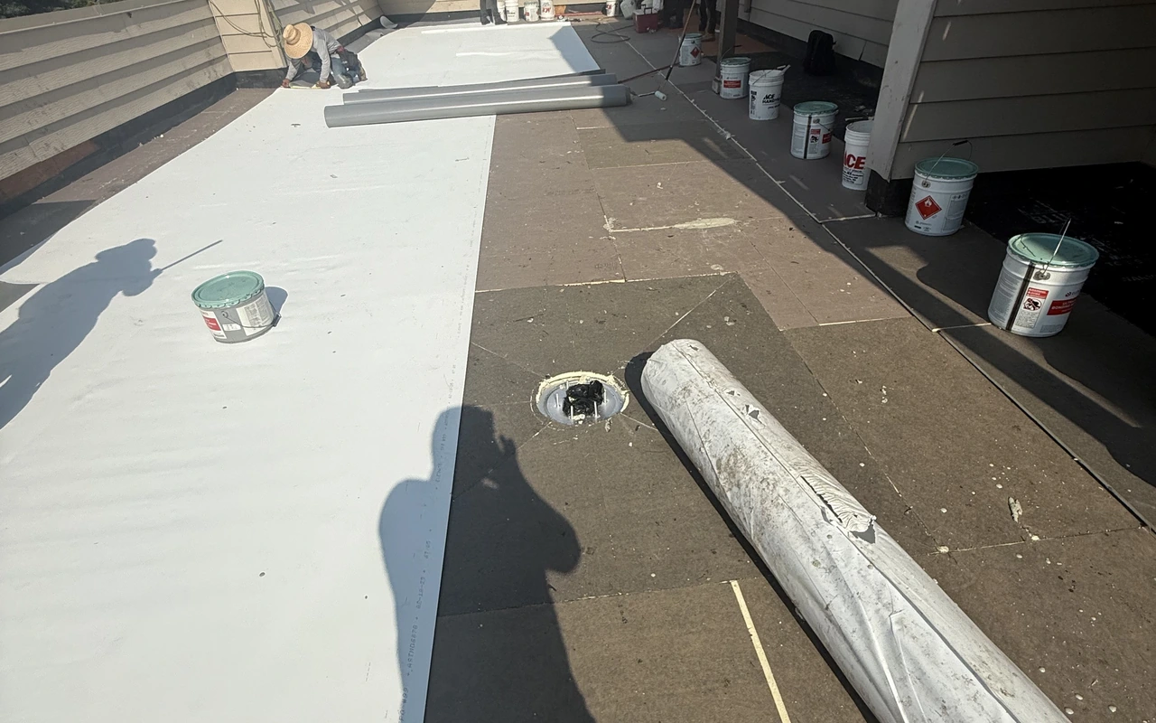 Modified bitumen flat roof replacement on industrial building in St. Paul, MN by Altus Roofing
